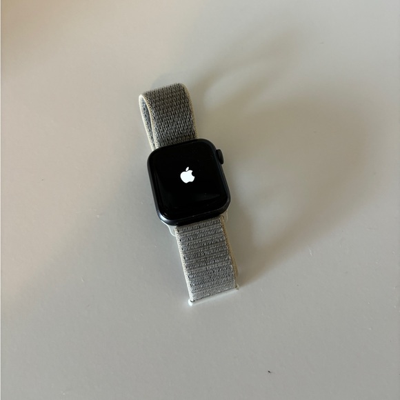 Black Apple Watch with adjustable band. Series 4 works perfectly